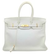 An Hermès White Togo Birkin 35 Handbag. White grained calfskin leather exterior with gold-toned