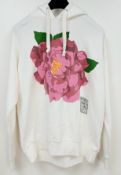 A White Gucci x Ken Scott Floral Print Hoodie. White cotton construction featuring a large pink