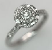 A 9K WHITE GOLD, MIXED CUT DIAMOND SET HALO RING. 0.36CTW. 2.1G, SIZE M. TAN 1002