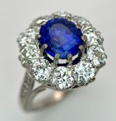 A Majestic Antique 18K White Gold Diamond and Sapphire Ring. A Sri Lankan 3.55ct Oval mixed cut