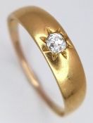 An 18K Yellow Gold and Diamond Gypsy Set Ring. Size P 1/2. 2.95g total weight.