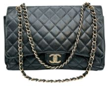 A Chanel Black Caviar Jumbo Single Flap Bag. Black diamond-quilted caviar leather exterior with
