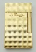 A S.T. Dupont Gold Plated Lighter. Diamond head pattern. Original packaging. Good condition. UK