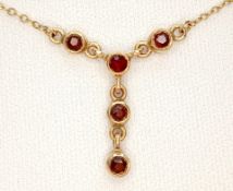 9 CARAT GOLD PENDANT NECKLACE with GARNET Detail. Approx 2.2 Grams. 45 cm. Please see pictures.