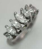 An 18K White Gold Marquise Cut Seven Stone Diamond Ring. Circa 1ctw diamonds. Ring size M. 5.58g