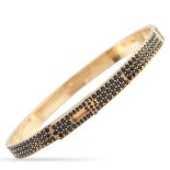 A Hermes Kelly 18K Rose Gold Spinel Bracelet. The bangle features inset spinel gemstones. Crafted