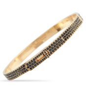 A Hermes Kelly 18K Rose Gold Spinel Bracelet. The bangle features inset spinel gemstones. Crafted