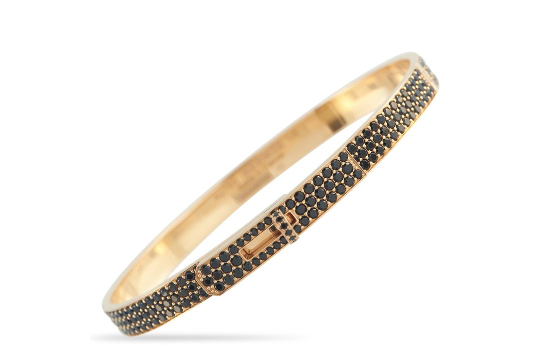 A Hermes Kelly 18K Rose Gold Spinel Bracelet. The bangle features inset spinel gemstones. Crafted - Bild 1 aus 4