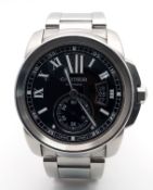 A Cartier Calibre de Cartier Automatic Gents Watch. Model W7100016. Stainless steel bracelet and