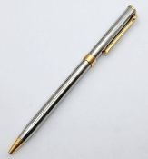 A Tiffany & Co. Polished Steel and Gold -plated Ballpoint Pen. New refill fitted June 2026. 13.5cm