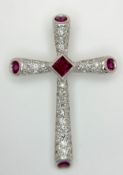 An 18K White Gold Ruby and Diamond Cross Pendant. Circa 0.45ctw diamonds. 3.4cm x 2.4cm. 3.6g