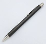A Santos de Cartier Silver and Palladium Finish Ballpoint Pen. 12.5cm Length. Complete with original