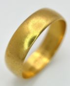 A 22K Yellow Gold Wedding Band. 5.7mm Band Width, Size P/Q. Total Weight 4.41 Grams.