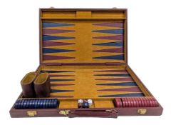 A Deluxe Backgammon Set. Boxed set comprising dice, doubling cube, playing pieces, pair of dice cups