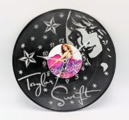 A Taylor Swift Custom Made Wall Clock. Laser-cut used vinyl creates the iconic Speak Now Album
