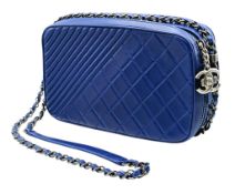A Chanel Blue Quilted Leather Camera Bag. Blue leather exterior with silver-toned hardware, chain