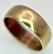 A 9K Yellow Gold Wedding Band. 6.6mm Band Width, Size R. Total Weight 3.11 Grams.