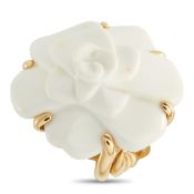 A Chanel Camelia 18K Yellow Gold White Ceramic Ring. The camellia design features layered white