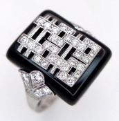 An 18K White Gold Art Deco Style Ring - A Rectangular Black Onyx Plaque Centred with an Intricate
