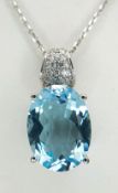 A Beautiful Oval Cut Blue Topaz, Diamond and 14k White Gold Pendant on a 14K White Gold Chain. C.