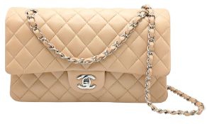A Beige Chanel Classic Double Flap Shoulder Bag. Beige quilted lambskin leather exterior with