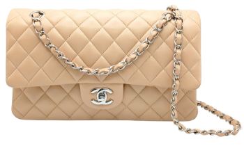 A Beige Chanel Classic Double Flap Shoulder Bag. Beige quilted lambskin leather exterior with