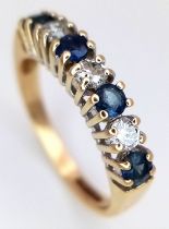 AN 18K YELLOW GOLD, DIAMOND AND SAPPHIRE, 7 STONE RING. 0.30CTW DIAMONDS AND 0.40CTW SAPPHIRES. 2.