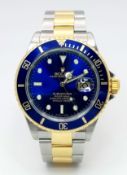 A Wonderful Rolex Submariner 'Bluesy' Automatic Gents Watch. Model 16613. Circa 2004. 18K gold and