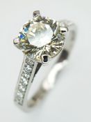 An 18K White Gold Diamond Solitaire Ring. A 1.70ct round brilliant cut diamond having J colour and