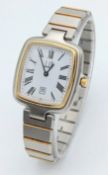 A Swiss Made Dunhill Millenium Two Tone Quartz Date Watch. Case measures 30 x 30mm. Serviced