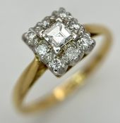 An 18K Yellow Gold and Platinum Diamond Cluster Ring. A 0.20ct Princess cut diamond with round