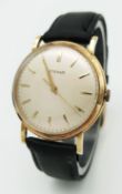 A Vintage 18K Gold Eterna Mechanical Gents Watch. Black leather strap. 18K Gold case - 34mm. Swiss