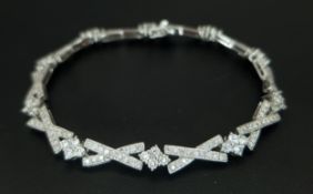 AN 18K WHITE GOLD, DIAMOND SET, FANCY LINK BRACELET. 1.50CTW. 10.9G. A/S 1359