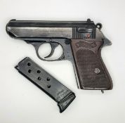 A Deactivated Vintage West German Walther PPK Semi-Automatic Pistol. Black finish with brown checked