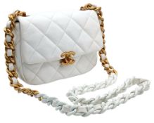 A Chanel Seasonal Flap Shoulder Bag. White quilted leather exterior with gold-tone hardware, CC