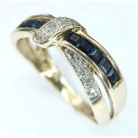 A 9K YELLOW GOLD, DIAMOND AND SAPPHIRE SET, TWIST DESIGN RING. 2.9G. SPSA 7005