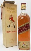 A BOTTLE OF 1970'S JOHNNIE WALKER "RED LABEL" OLD SCOTCH WHISKY .