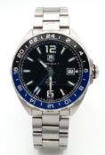A Tag Heuer Formula 1, Calibre 7, GMT Quartz Gents Watch. Model WAZ211a. Stainless steel bracelet