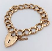 A Beautiful Chunky 9K Yellow Gold Curb Link Bracelet with Heart Clasp and Safety Chain. 17cm. 36g