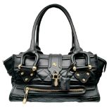 A Burberry Black Quilted Leather Manor Bag. Black leather exterior with diamond-quilted panels,