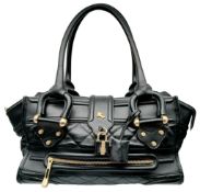 A Burberry Black Quilted Leather Manor Bag. Black leather exterior with diamond-quilted panels,