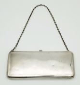 AN ANTIQUE SOLID SILVER RUSSIAN PURSE WITH A RUBY AND ON A CHAIN . 210 3gms 16 x 6.5cms apprx