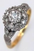 An 18K Yellow Gold and Platinum Diamond Tier Setting Cluster Ring. Circa 0.3ctw of round brilliant