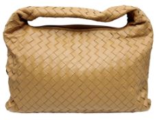 A Bottega Veneta Intrecciato Large Hop Hobo Bag. Camel woven Intrecciato leather exterior with an