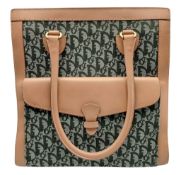 A Christian Dior Oblique Canvas Tote Bag. Green Dior Oblique monogram canvas exterior with tan