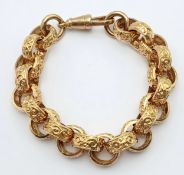 A Chunky 9K Gold Statement Bracelet with Circular, Intricate Pattern Engraved Links. Large lobster
