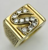 A 14K Yellow Gold and Diamond Signet Ring. Substantial in weight with a ten diamond pave set