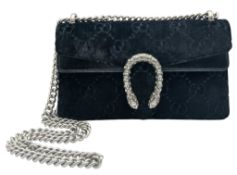 A Gucci Velvet GG Monogram Dionysus Shoulder Bag. Black GG monogram velvet exterior with black