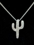 AN 18K WHITE GOLD, DIAMOND SET, CACTUS PENDANT ON AN 18K WHITE GOLD, 18" NECKLACE. 3.4G. SC 8061