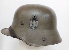 Transitional Period German M17 Stahl Helm complete with M35 Liner, chinstrap and 3rd Reich Decals.